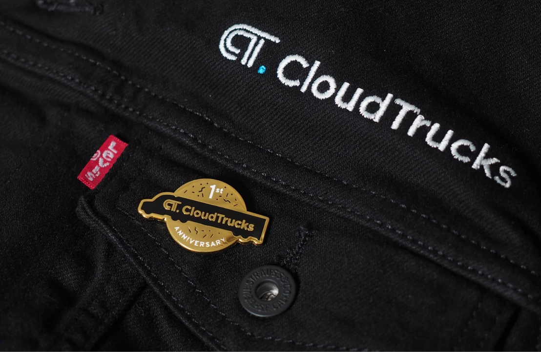CloudTrucks anniversary pin and trucker jacket